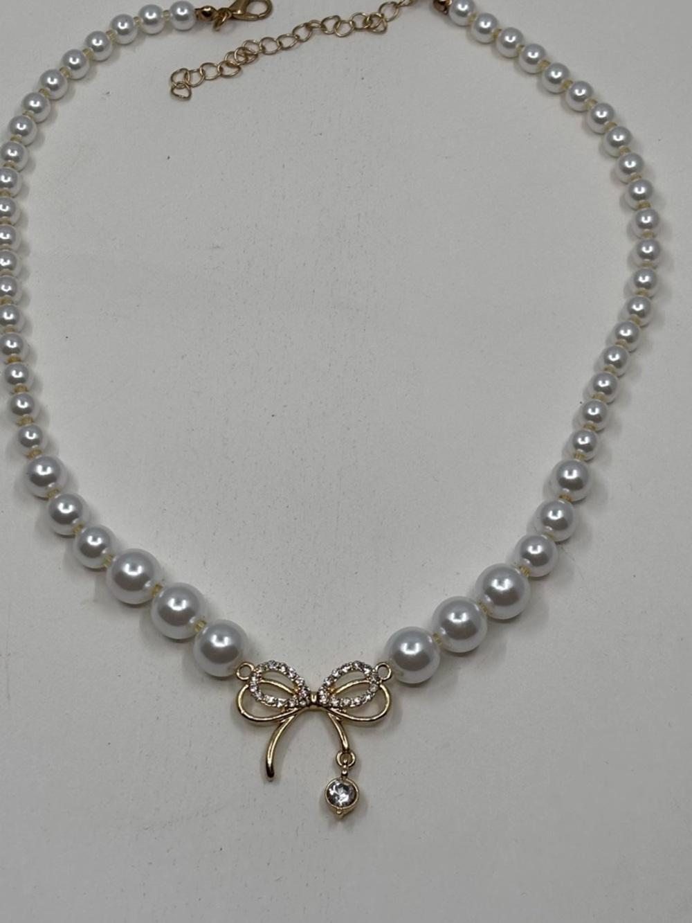 Elegant Gold Bow Pearl Necklace - White Pearls